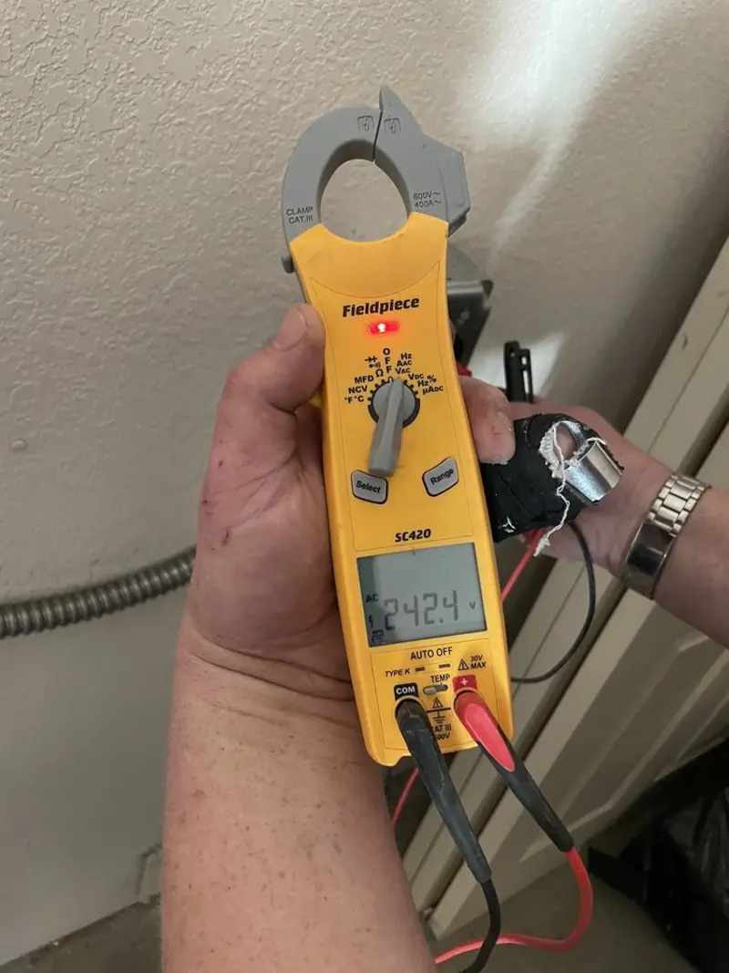 Voltage testing with clamp meter during Generator Installation in Grover Beach